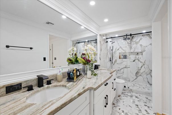 Bathroom, Dual Sink Vanities, Interior, Marble, Marble Walls, Recessed Lighting
