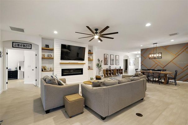 Dining room, Fireplace, Interior, Living room, Pendant Lights, Recessed Lighting, Wood Texture Flooring
