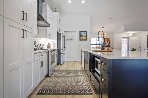 Chandelier, Interior, Kitchen, Recessed Lighting, Stainless Steel Appliances, Wood Texture Flooring
