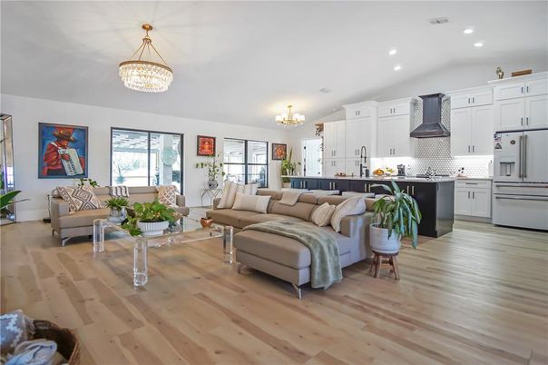 Chandelier, Interior, Kitchen, Living room, Recessed Lighting, Stainless Steel Appliances, Wood Texture Flooring
