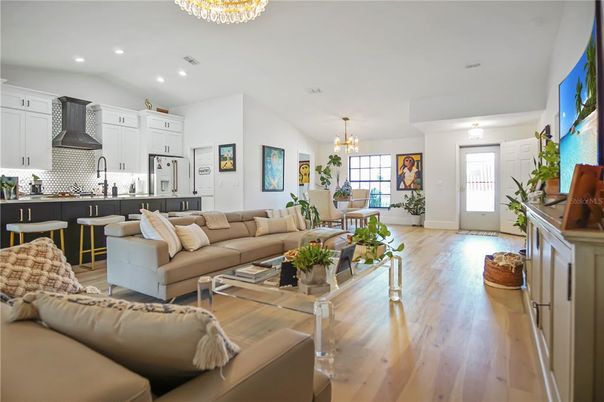 Chandelier, Dining room, Interior, Kitchen, Living room, Recessed Lighting, Stainless Steel Appliances, Wood Texture Flooring