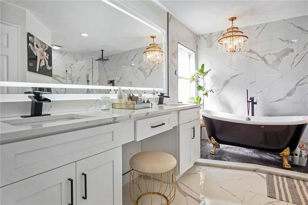 Bathroom, Chandelier, Dual Sink Vanities, Free Standing Baths, Interior, Marble, Marble Walls, Recessed Lighting