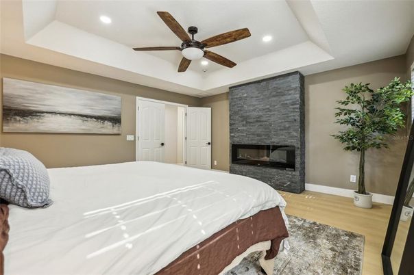 Bedroom, Fireplace, Interior, Recessed Lighting, Wood Texture Flooring