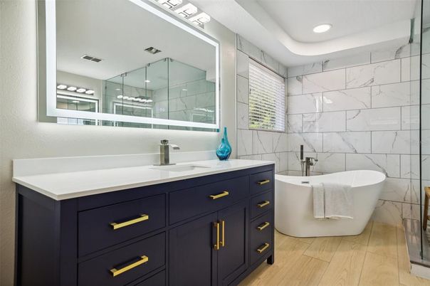 Bathroom, Dual Sink Vanities, Free Standing Baths, Glass Shower, Interior, Marble Walls, Recessed Lighting, Wood Texture Flooring