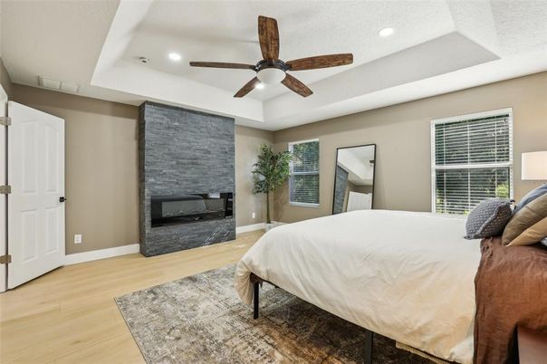 Bedroom, Fireplace, Interior, Recessed Lighting, Wood Texture Flooring