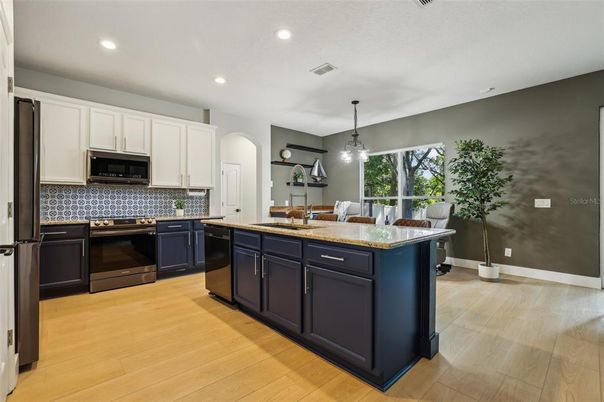 Dining room, Interior, Kitchen, Pendant Lights, Recessed Lighting, Stainless Steel Appliances, Wood Texture Flooring