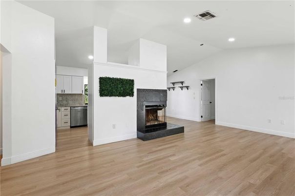 Empty room, Fireplace, Interior, Kitchen, Recessed Lighting, Wood Texture Flooring