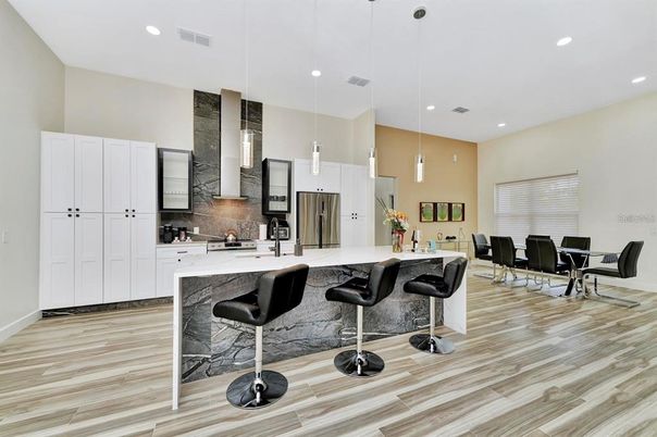 Dining room, Interior, Kitchen, Pendant Lights, Recessed Lighting, Stainless Steel Appliances, Wood Texture Flooring