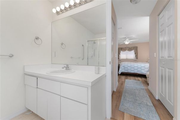 Bathroom, Bedroom, Dual Sink Vanities, Glass Shower, Interior, Wood Texture Flooring