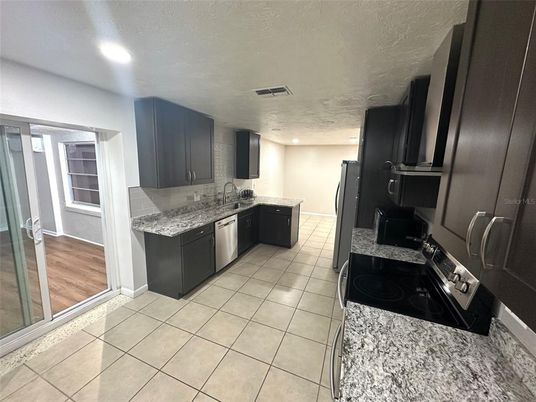 Interior, Kitchen, Recessed Lighting, Stainless Steel Appliances, Wood Texture Flooring