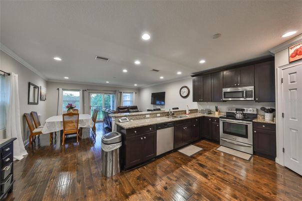 Dining room, Interior, Kitchen, Recessed Lighting, Stainless Steel Appliances, Wood Texture Flooring