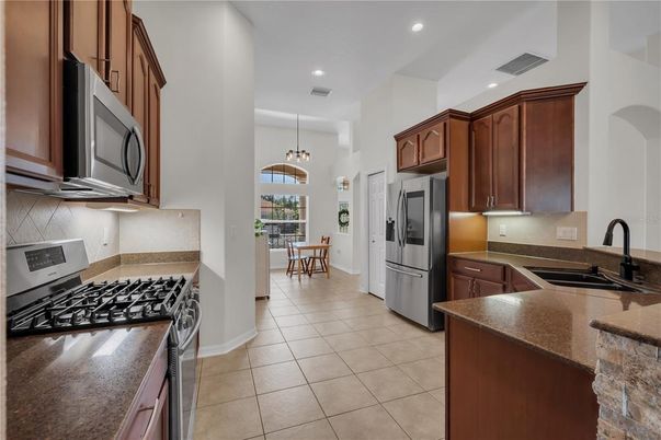 Chandelier, Dining room, Interior, Kitchen, Pendant Lights, Recessed Lighting, Stainless Steel Appliances