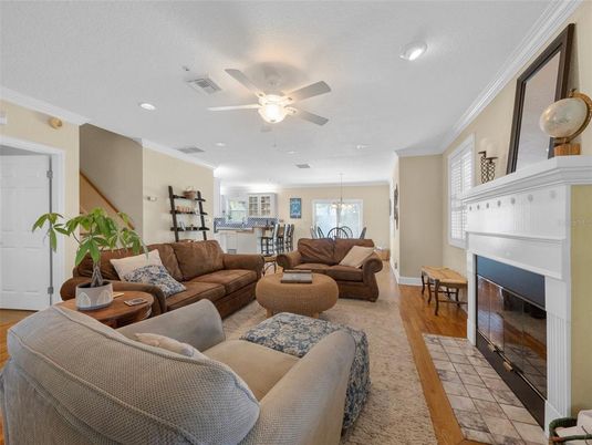 Dining room, Fireplace, Interior, Living room, Recessed Lighting, Wood Texture Flooring
