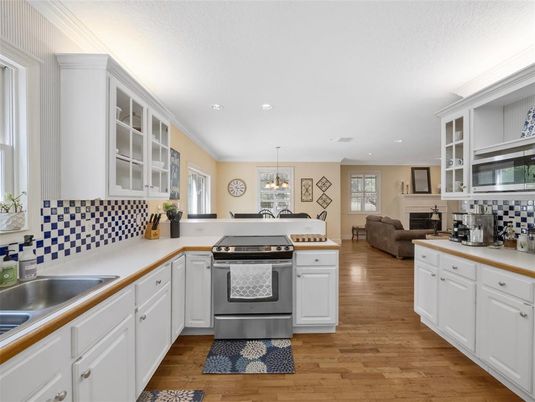 Chandelier, Interior, Kitchen, Living room, Pendant Lights, Recessed Lighting, Stainless Steel Appliances, Wood Texture Flooring