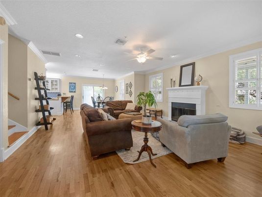 Dining room, Fireplace, Interior, Living room, Pendant Lights, Recessed Lighting, Wood Texture Flooring