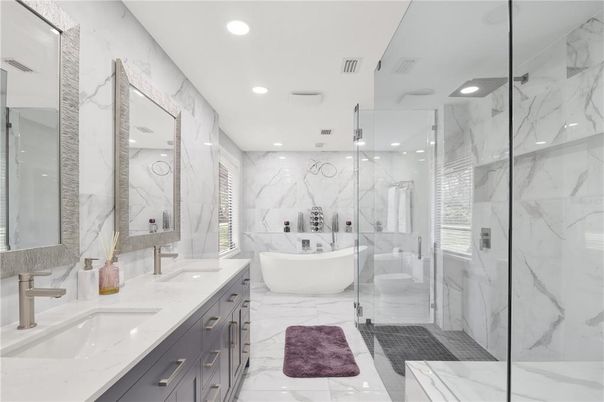 Bathroom, Dual Sink Vanities, Free Standing Baths, Glass Shower, Interior, Marble, Marble Walls, Recessed Lighting