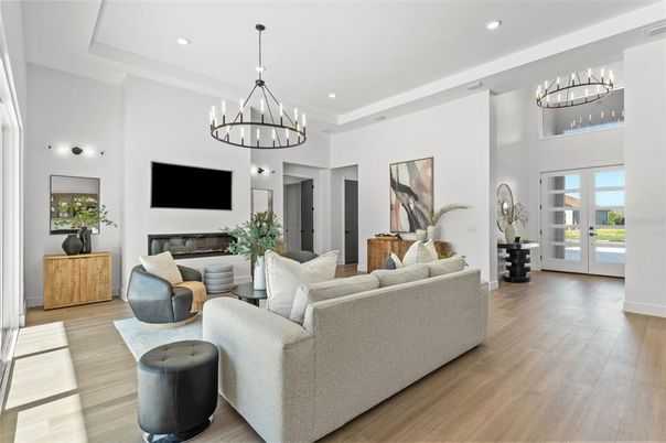 Chandelier, Fireplace, Interior, Living room, Recessed Lighting, Wood Texture Flooring