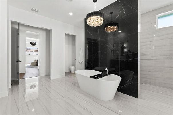 Bathroom, Chandelier, Free Standing Baths, Interior, Marble, Marble Walls, Pendant Lights, Recessed Lighting