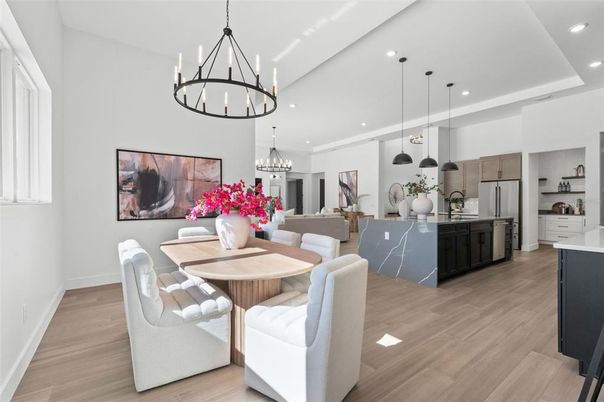 Chandelier, Dining room, Interior, Kitchen, Living room, Pendant Lights, Recessed Lighting, Stainless Steel Appliances, Wood Texture Flooring