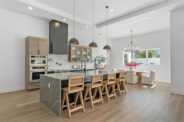 Dining room, Interior, Kitchen, Pendant Lights, Recessed Lighting, Stainless Steel Appliances, Wood Texture Flooring