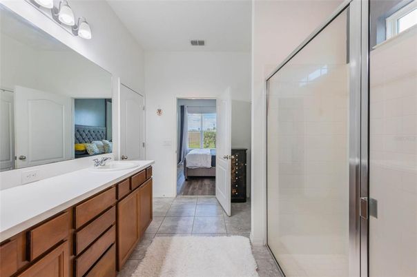 Bathroom, Bedroom, Dual Sink Vanities, Glass Shower, Interior, Wood Texture Flooring