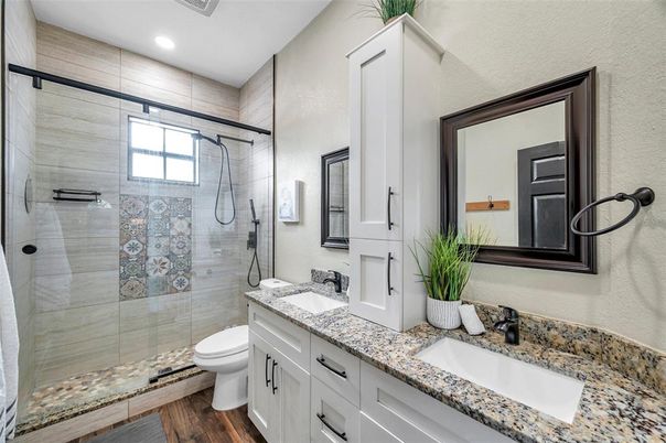 Bathroom, Dual Sink Vanities, Glass Shower, Interior, Recessed Lighting, Wood Texture Flooring