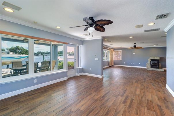 Empty room, Fireplace, Interior, Recessed Lighting, Water, Wood Texture Flooring