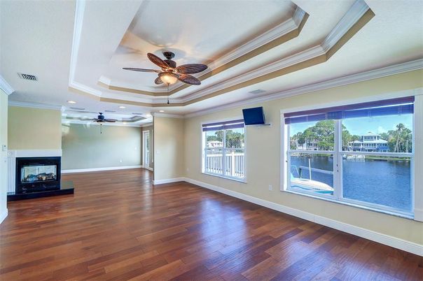 Empty room, Fireplace, Interior, Recessed Lighting, Water, Wood Texture Flooring