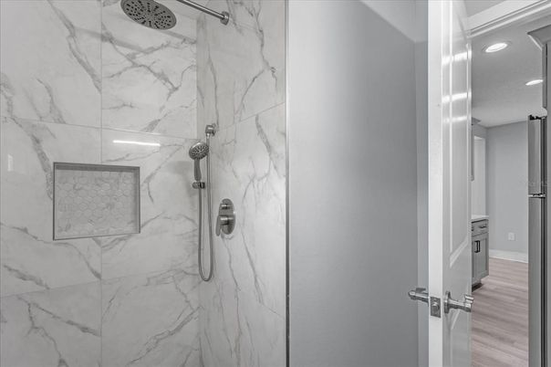 Bathroom, Glass Shower, Interior, Marble Walls, Recessed Lighting, Wood Texture Flooring