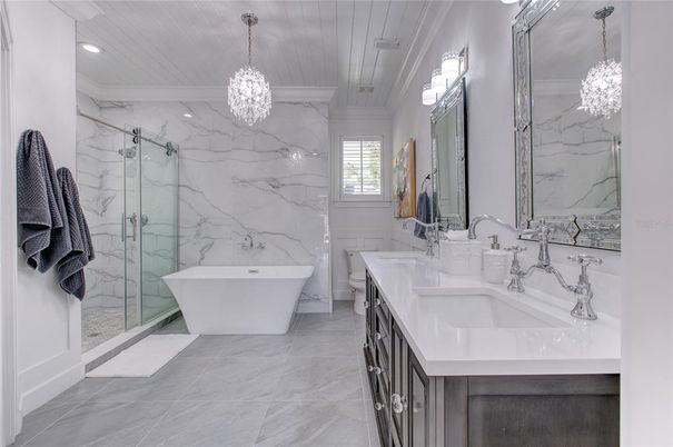 Bathroom, Dual Sink Vanities, Free Standing Baths, Glass Shower, Interior, Marble, Marble Walls, Pendant Lights, Recessed Lighting