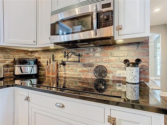 Interior, Kitchen, Recessed Lighting, Stainless Steel Appliances, Stone Walls