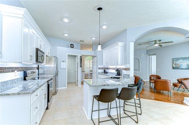 Dining room, Interior, Kitchen, Living room, Pendant Lights, Recessed Lighting, Stainless Steel Appliances, Wood Texture Flooring