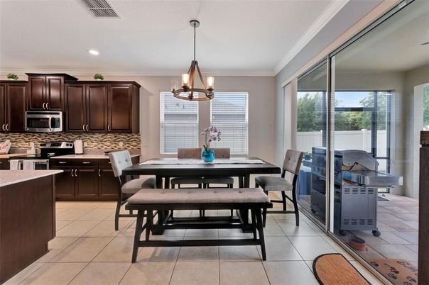 Chandelier, Dining room, Interior, Kitchen, Pendant Lights, Recessed Lighting, Stainless Steel Appliances