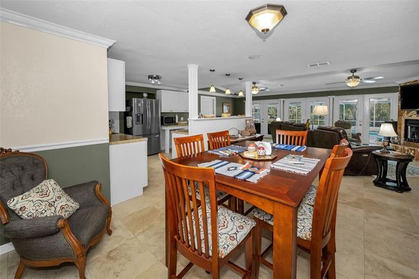 Dining room, Fireplace, Interior, Kitchen, Living room, Pendant Lights, Stainless Steel Appliances
