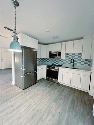 Interior, Kitchen, Pendant Lights, Stainless Steel Appliances, Wood Texture Flooring