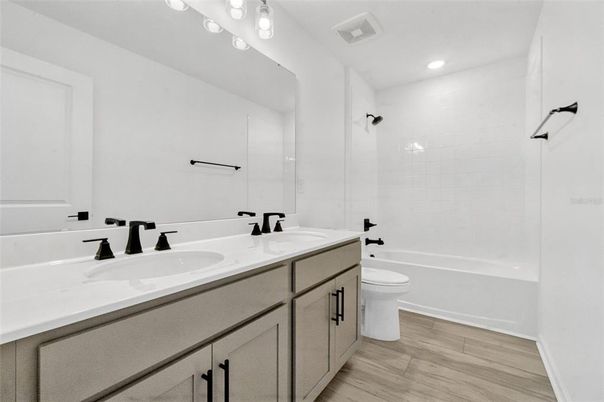 Bathroom, Dual Sink Vanities, Interior, Recessed Lighting, Wood Texture Flooring
