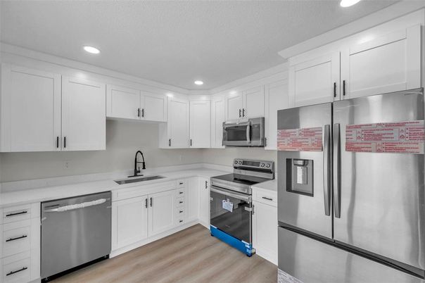 Interior, Kitchen, Recessed Lighting, Stainless Steel Appliances, Wood Texture Flooring