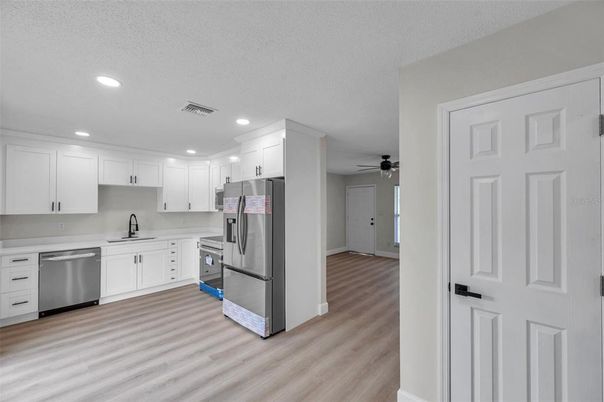 Interior, Kitchen, Recessed Lighting, Stainless Steel Appliances, Wood Texture Flooring
