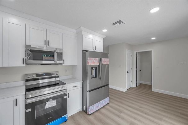 Interior, Kitchen, Recessed Lighting, Stainless Steel Appliances, Wood Texture Flooring