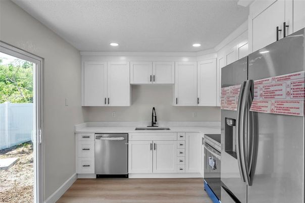 Interior, Kitchen, Recessed Lighting, Stainless Steel Appliances, Wood Texture Flooring