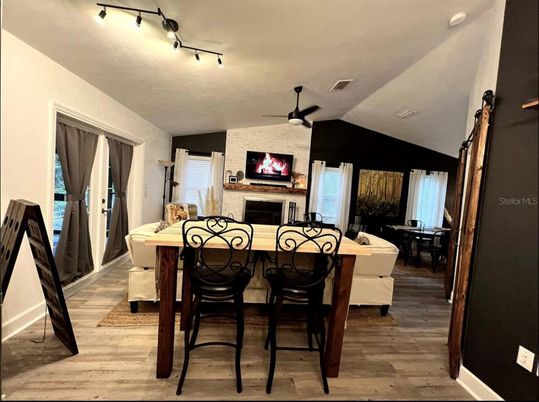 Dining room, Fireplace, Interior, Living room, Stone Walls, Wood Texture Flooring