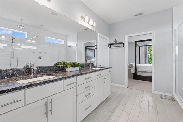 Bathroom, Dual Sink Vanities, Glass Shower, Interior, Wood Texture Flooring