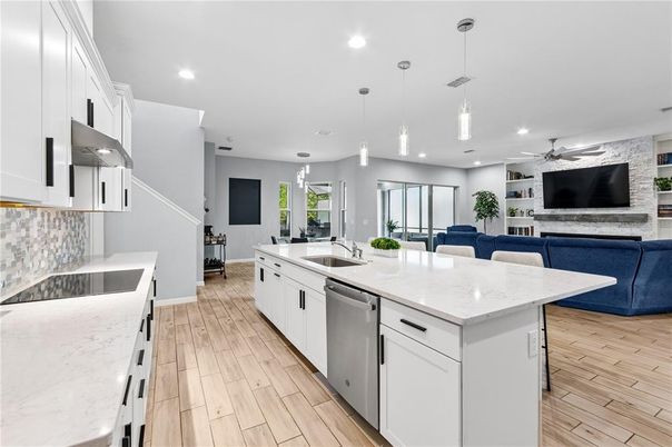 Dining room, Interior, Kitchen, Living room, Pendant Lights, Recessed Lighting, Stainless Steel Appliances, Wood Texture Flooring