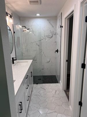Bathroom, Dual Sink Vanities, Glass Shower, Interior, Marble, Marble Walls, Recessed Lighting