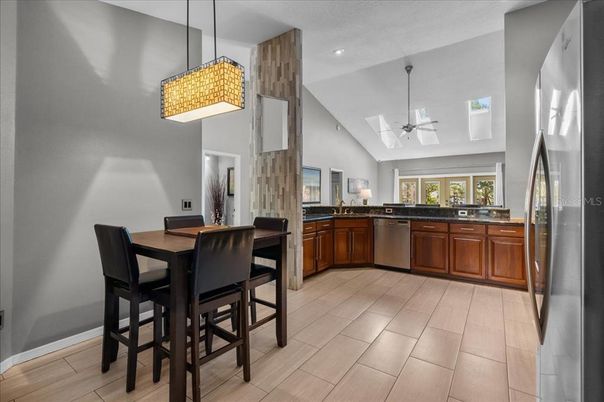Dining room, Interior, Kitchen, Pendant Lights, Recessed Lighting, Stainless Steel Appliances, Wood Texture Flooring