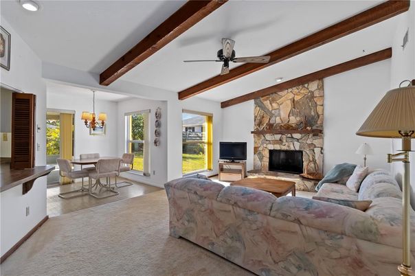 Dining room, Fireplace, Interior, Living room, Recessed Lighting, Stone Walls, Wooden Beams, Wood Texture Flooring