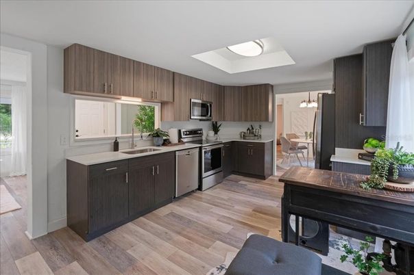 Dining room, Interior, Kitchen, Pendant Lights, Stainless Steel Appliances, Wood Texture Flooring