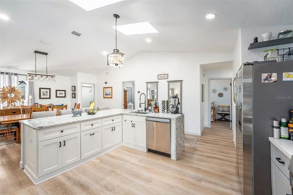 Dining room, Interior, Kitchen, Pendant Lights, Recessed Lighting, Stainless Steel Appliances, Wood Texture Flooring