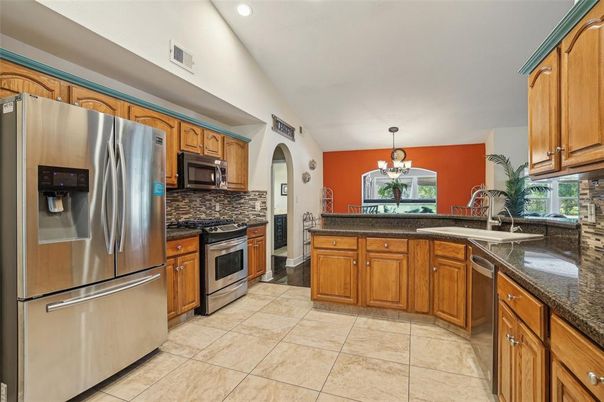 Chandelier, Dining room, Interior, Kitchen, Pendant Lights, Recessed Lighting, Stainless Steel Appliances