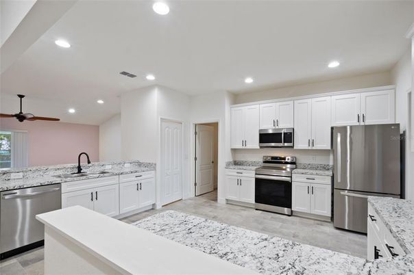 Interior, Kitchen, Recessed Lighting, Stainless Steel Appliances, Wood Texture Flooring